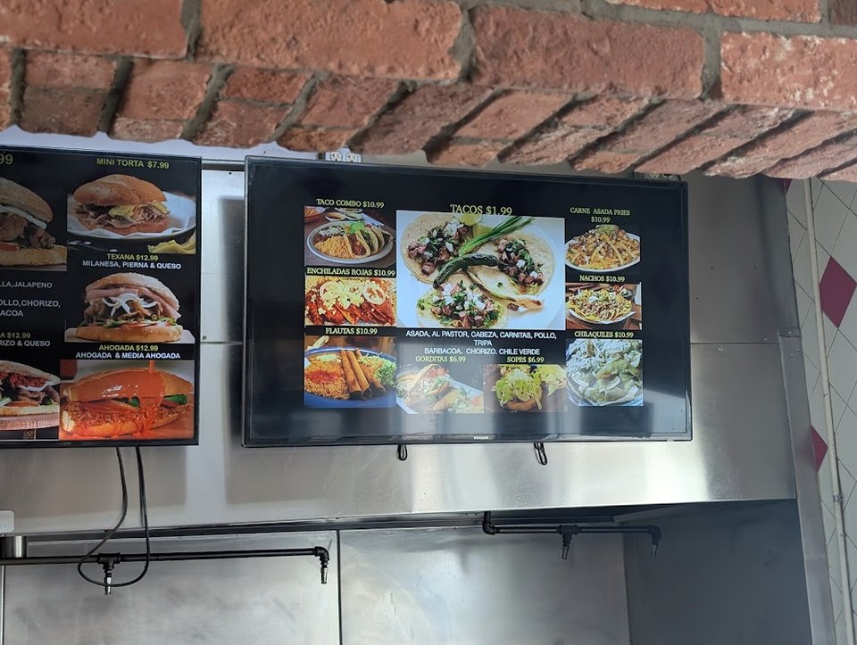 Tortas, tacos, and mariscos listed on paper.